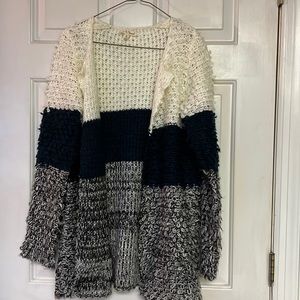 White, dark green, and black/white cardigan